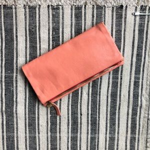 Clare Vivier food over clutch in a peachy coral